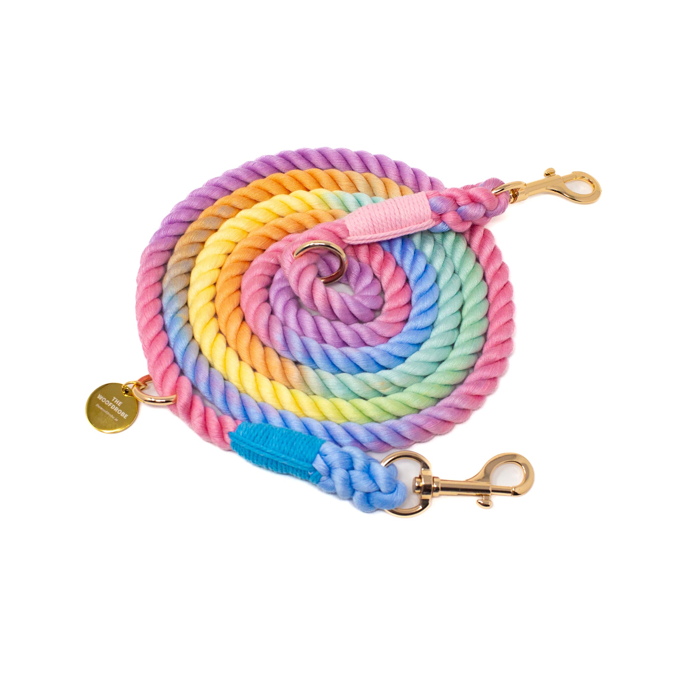 Colorful rope dog leash with gold hardware on a white background