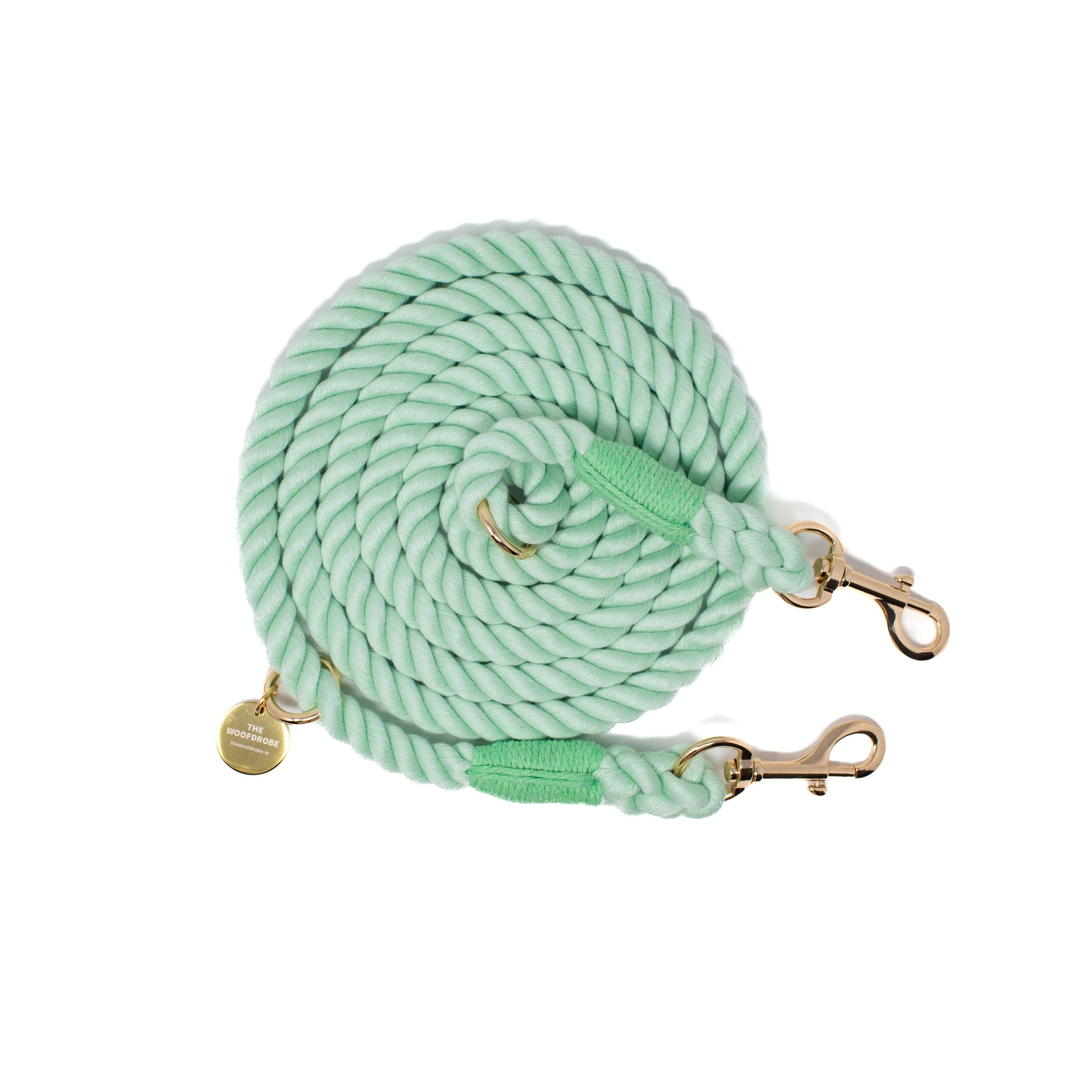 Light green rope leash with gold clasp on a white background