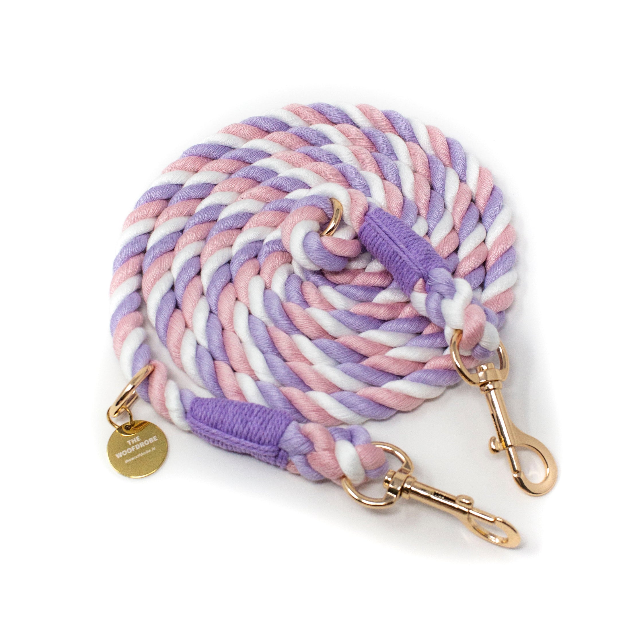 Multicolored braided leash with gold hardware on a white background
