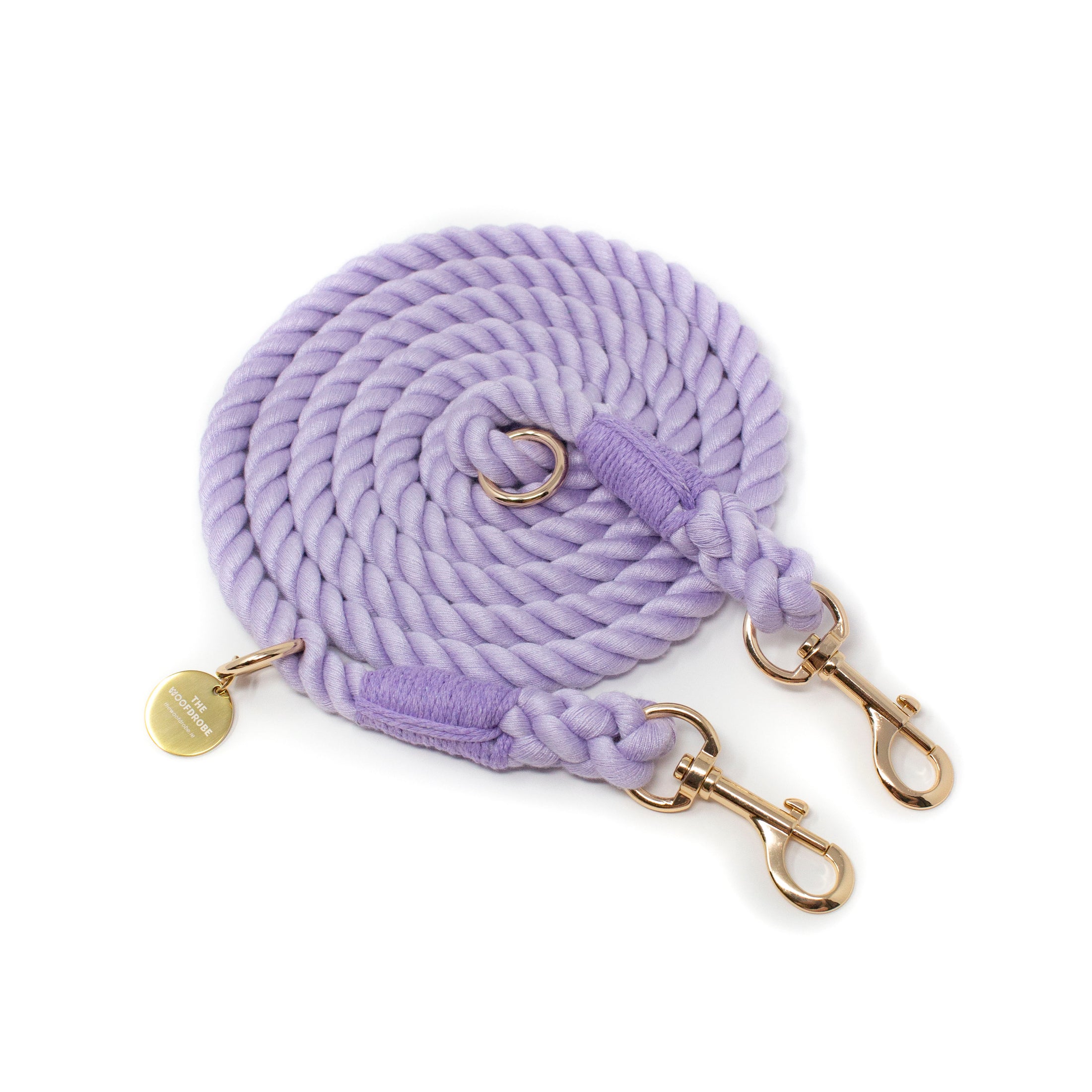 Purple braided rope leash with gold hardware on a white background
